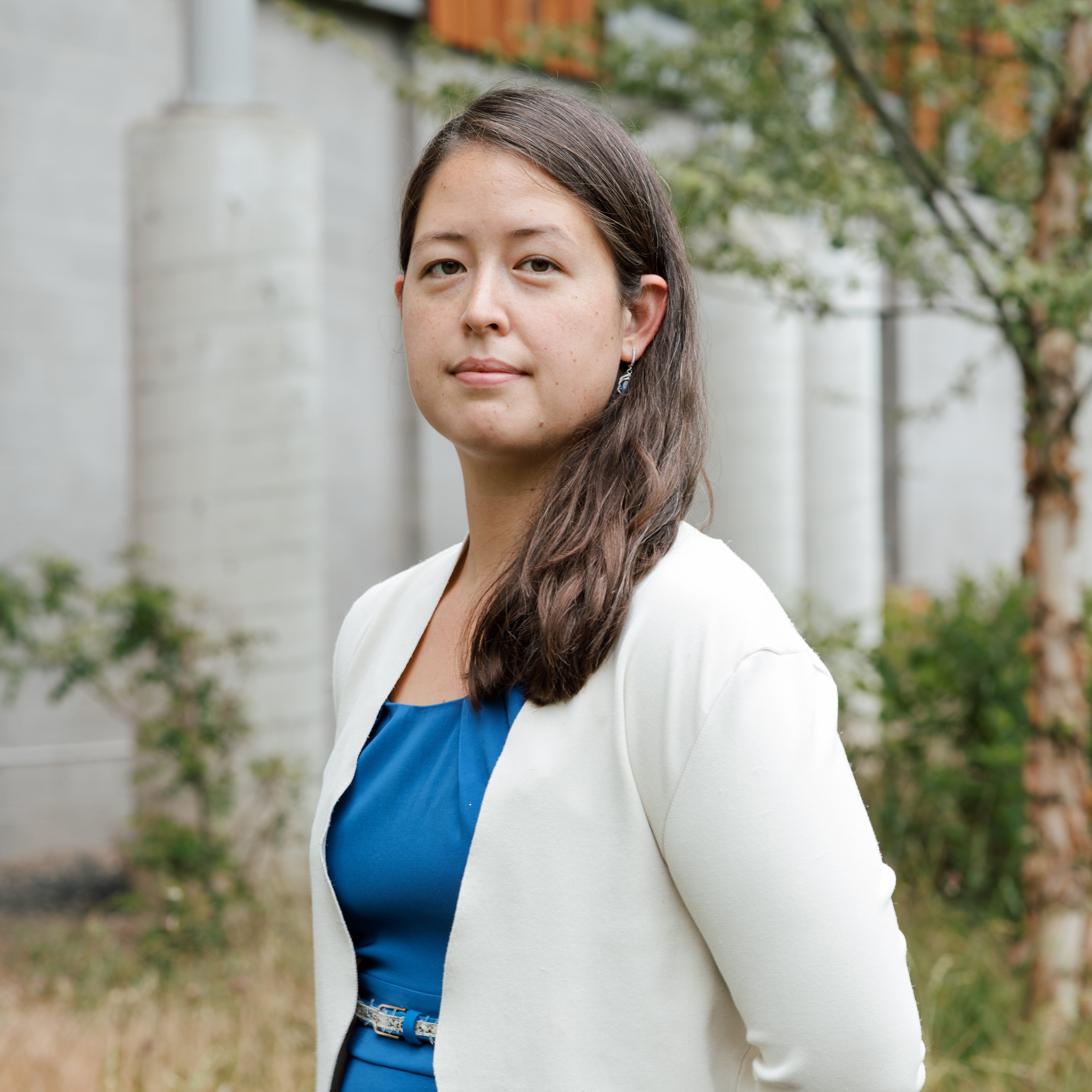 Dr. Rebecca Portnoff portrait shot wearing a blue shirt and white cardigan